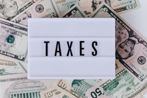 decorative photo of text say TAXES