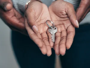 decorative photo of hands with a key